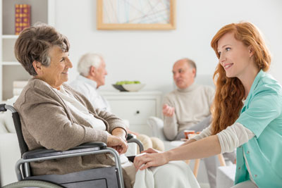 Nurse with patient in wheelchair.